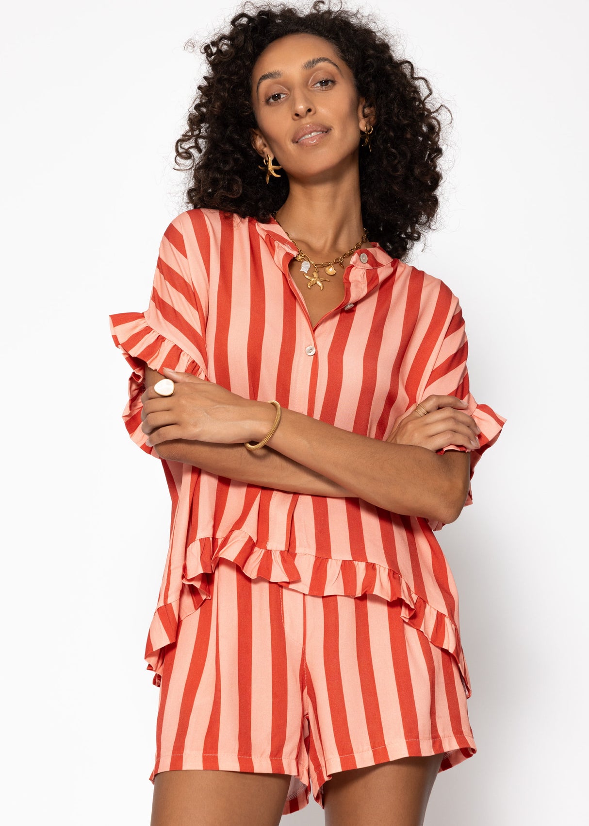 Striped blouse with ruffled hem - red