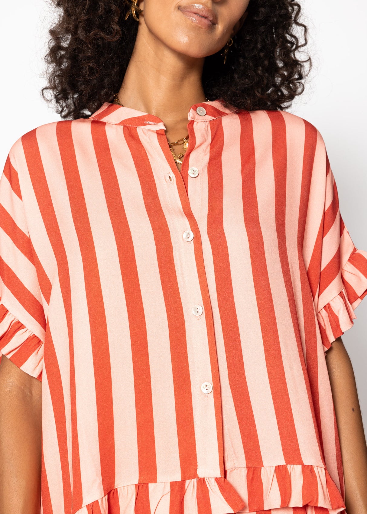 Striped blouse with ruffled hem - red