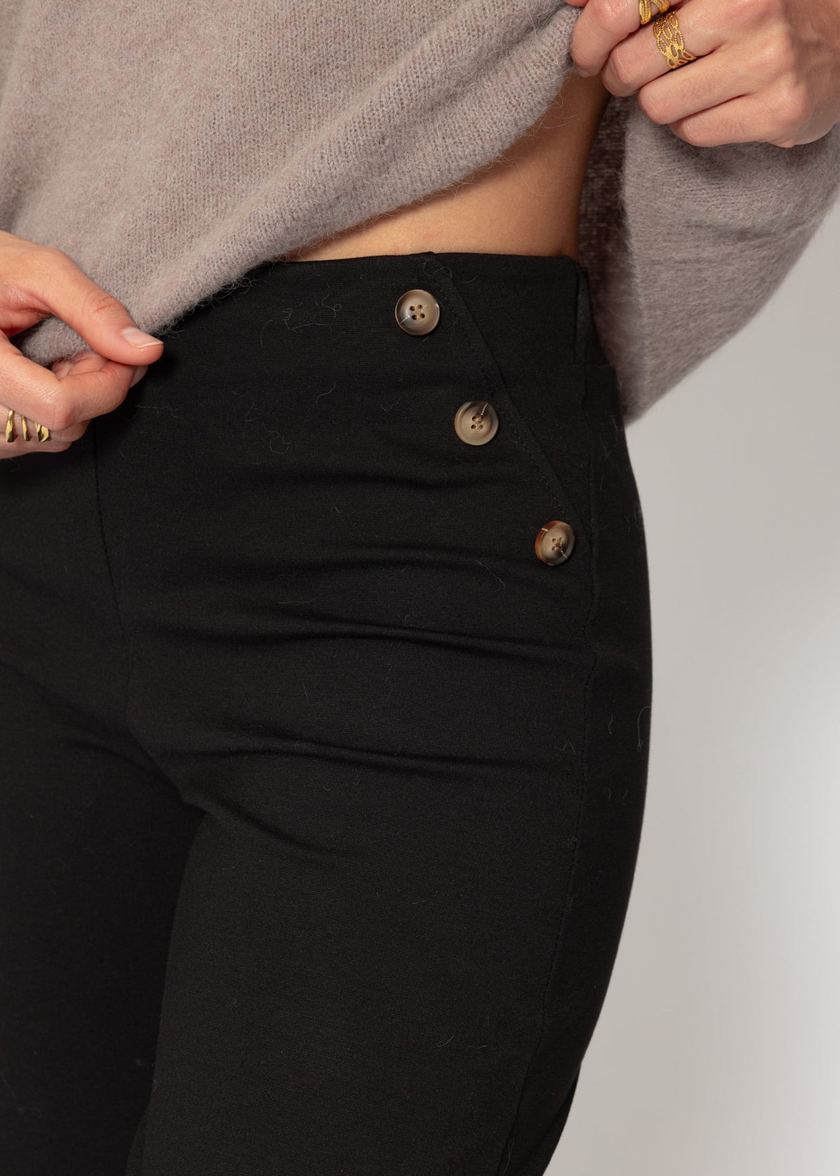 Trousers with decorative buttons - black