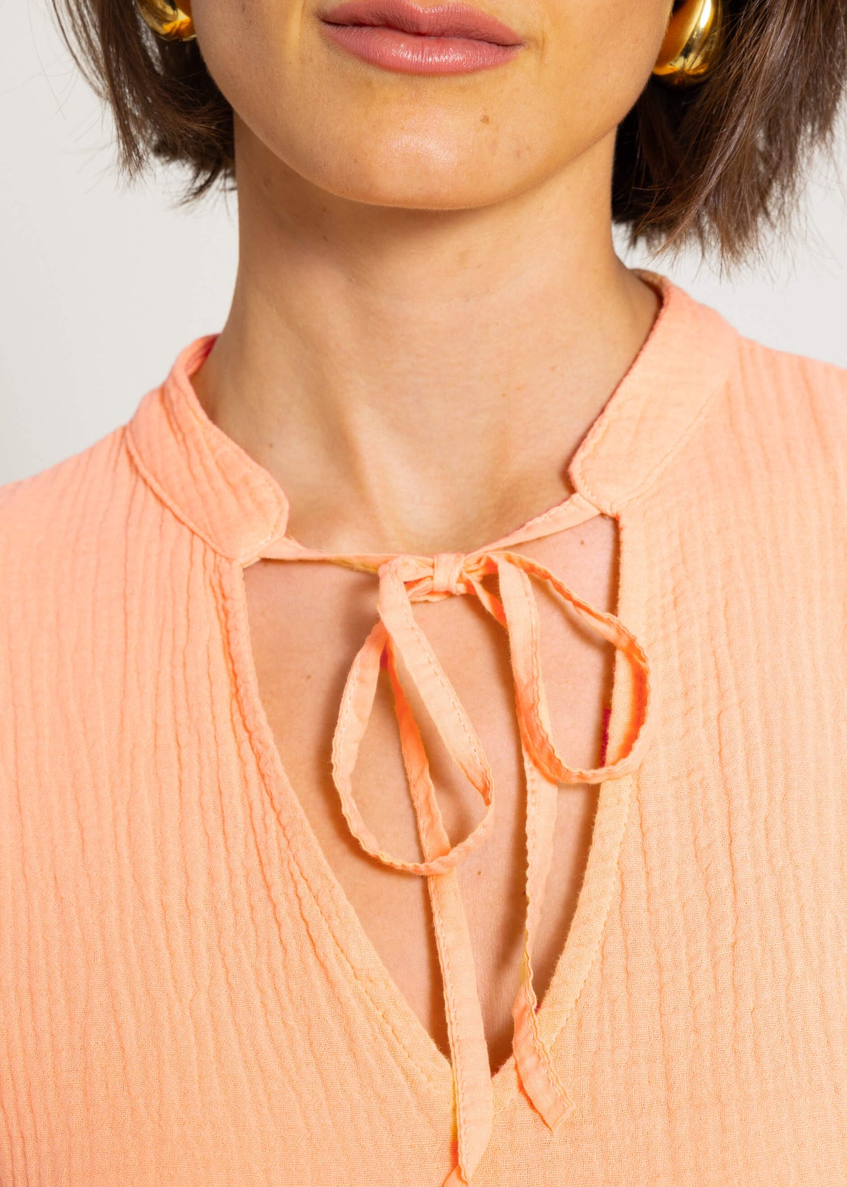 Short muslin dress with flounces - peach