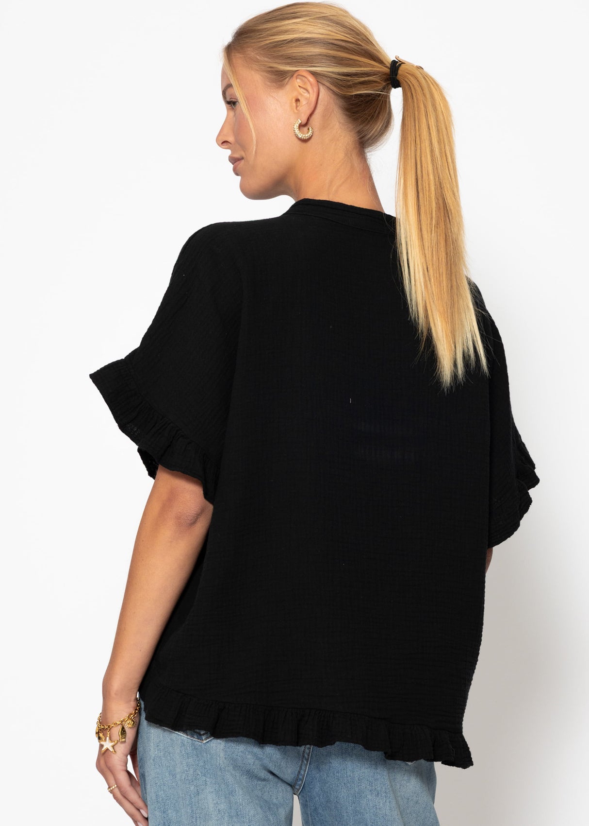 Musselin blouse with ruffled hem - black