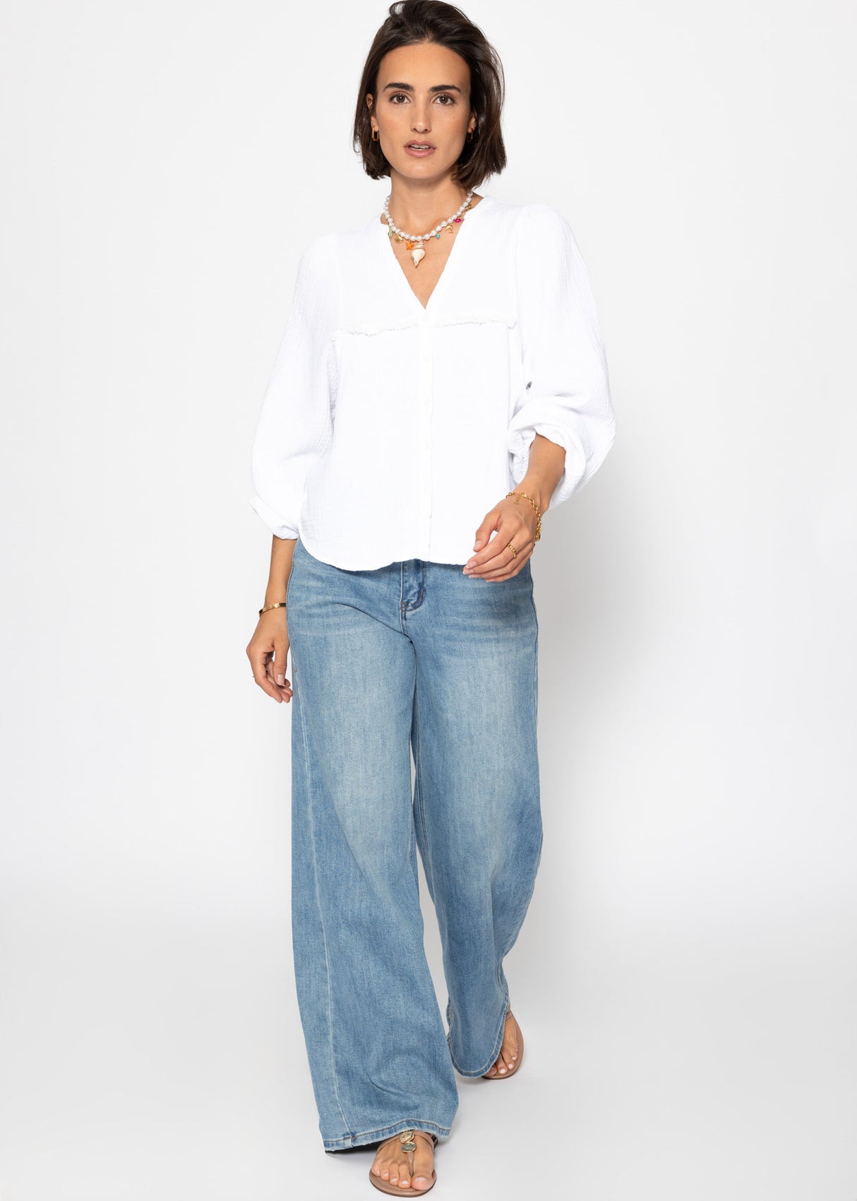 Muslin blouse with V-neck and fringes - white