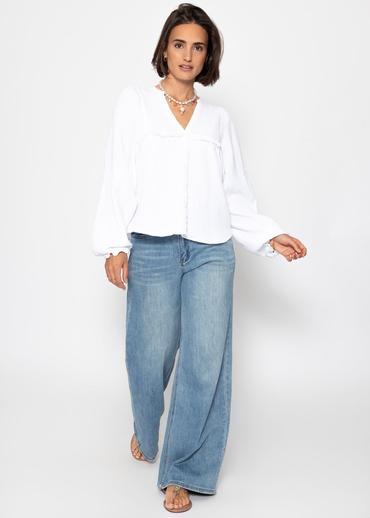 Muslin blouse with V-neck and fringes - white
