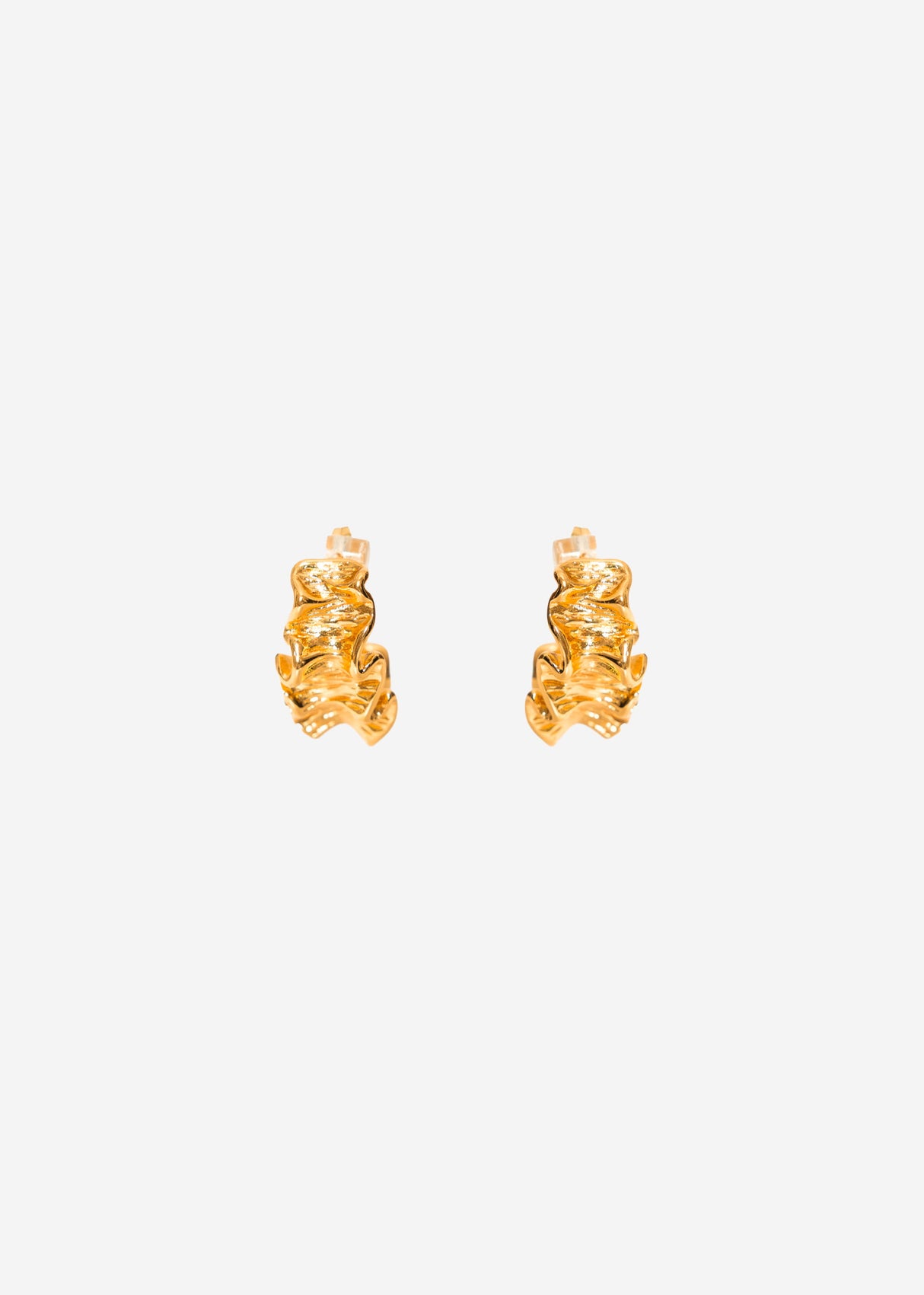 Stud earrings in sculptural form - gold