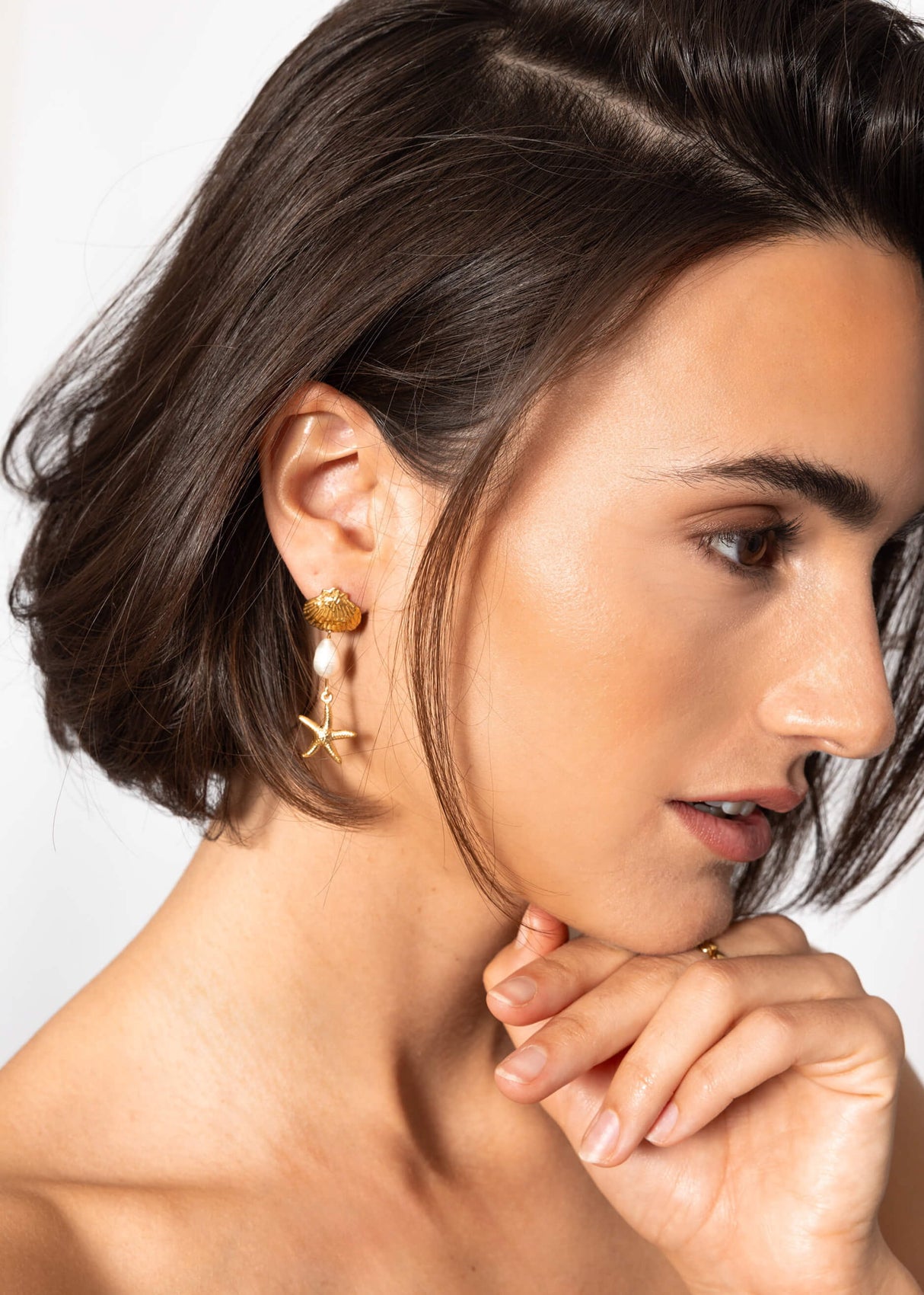 Ear connector with a shell and naval esters - gold