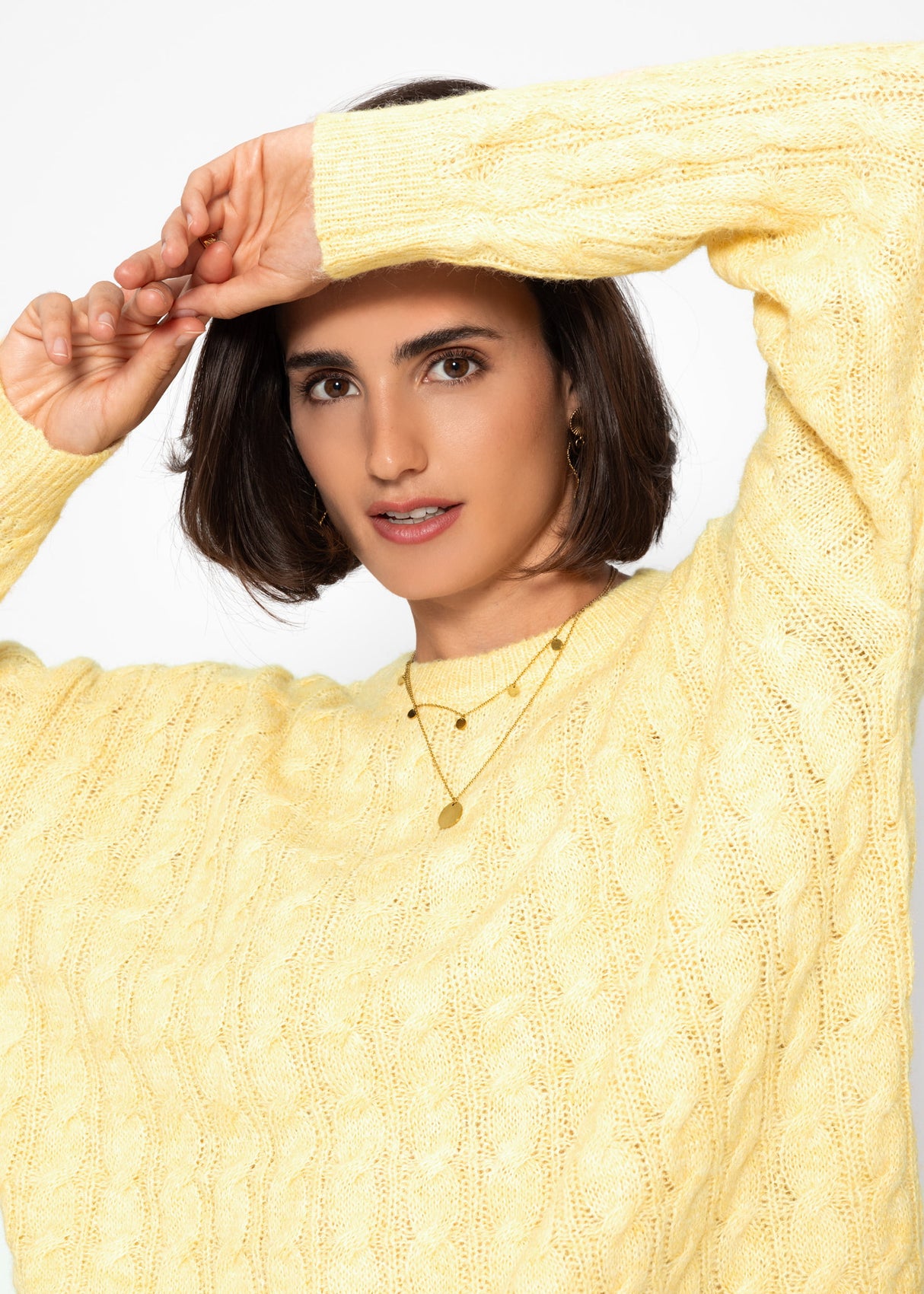 Sweater with a cable pattern - yellow