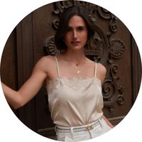 Champagne-colored women's satin top with lace trim and spaghetti straps, styled with white pants and a gold necklace - Tops by SASSYCLASSY