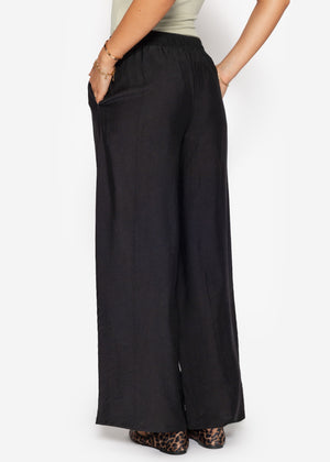 Glänzende Stoffhose mit geradem Bein - schwarz