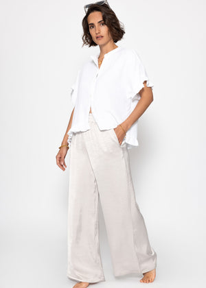 Musselin blouse with ruffled hem - white