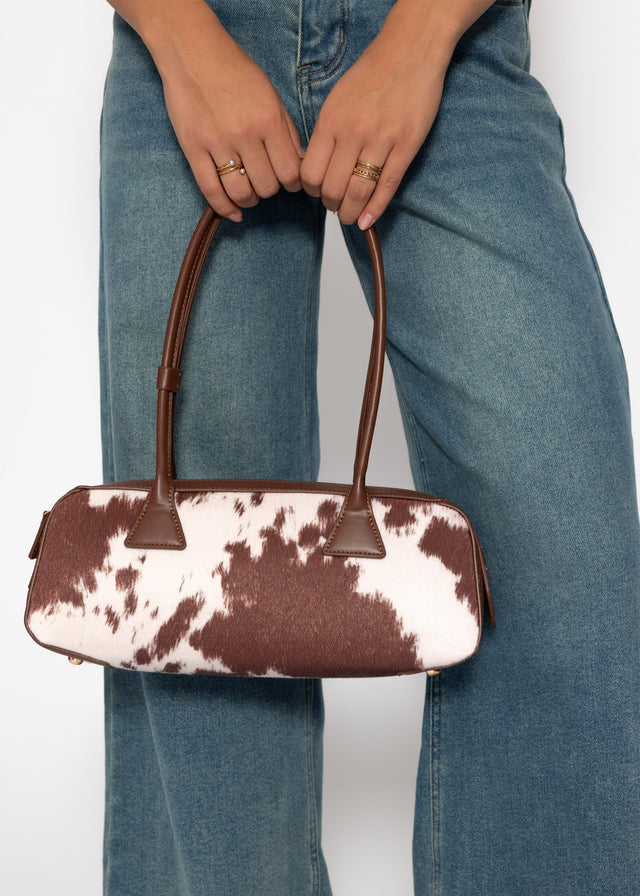 Faux leather shoulder bag with cow print - brown