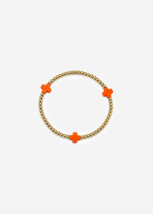 Armband mit roten Schmucksteinen - gold