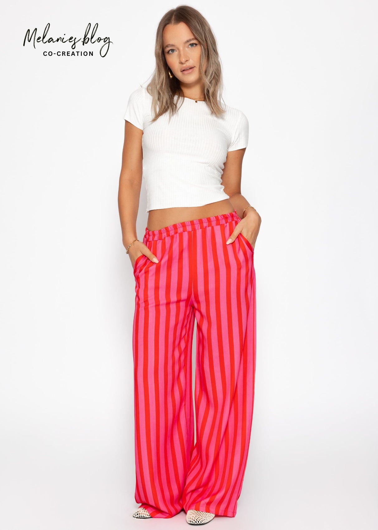 Gestreifte Hose mit weitem Bein - pink