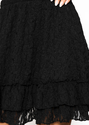 Kurzer Volant-Rock aus Spitze - schwarz