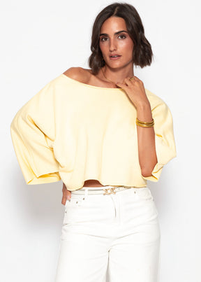 Kurzes Sweatshirt mit Fledermausärmel - buttergelb