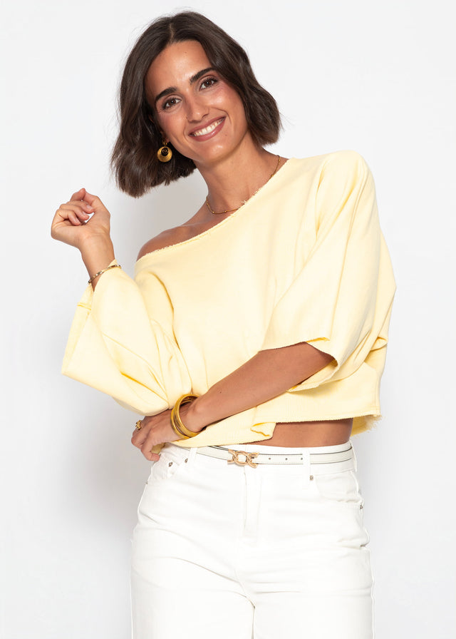 Kurzes Sweatshirt mit Fledermausärmel - buttergelb