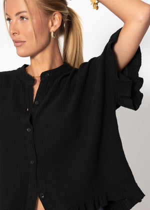 Musselin Bluse mit Rüschensaum - schwarz