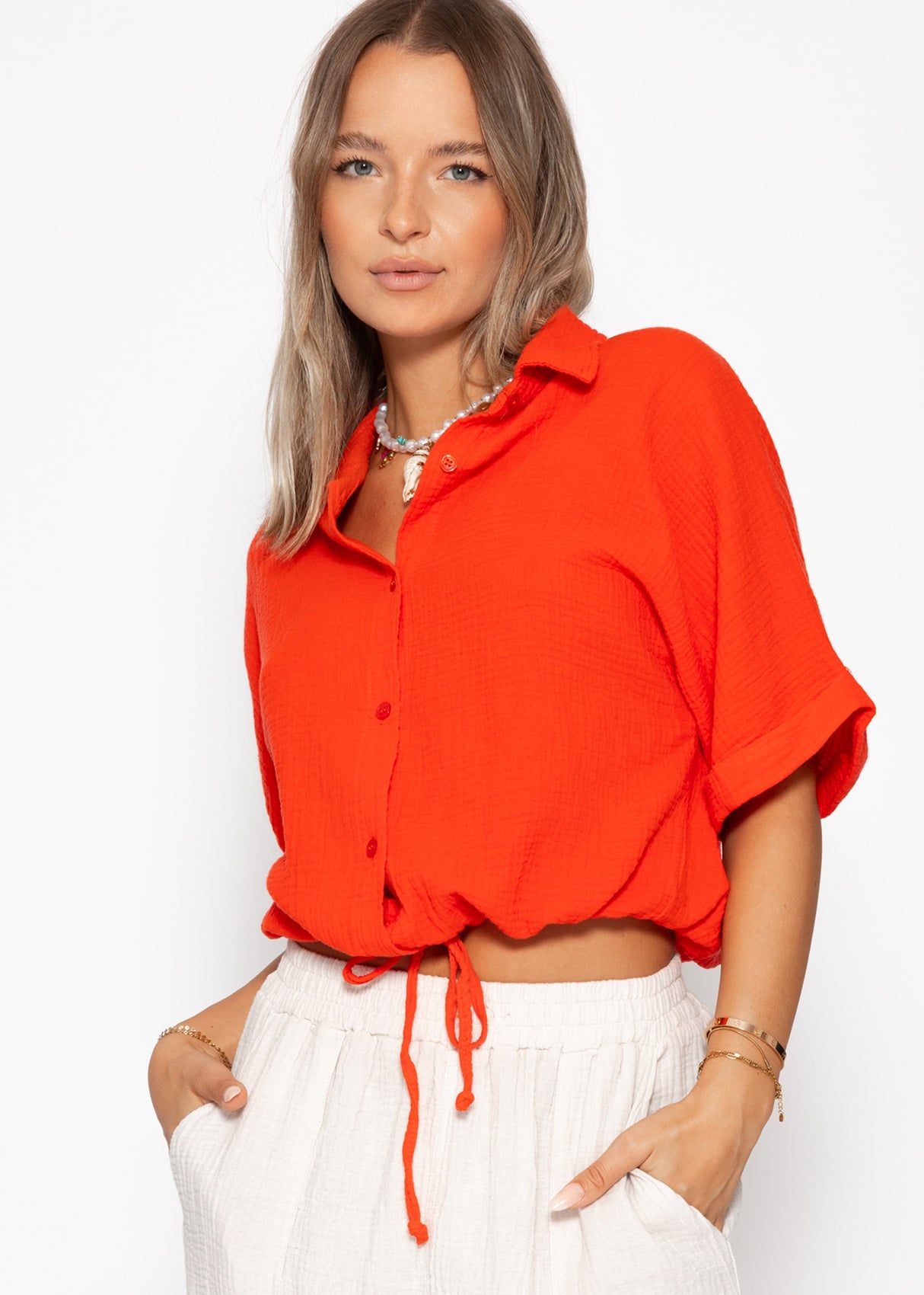 Musselin blouse with a train band - orange