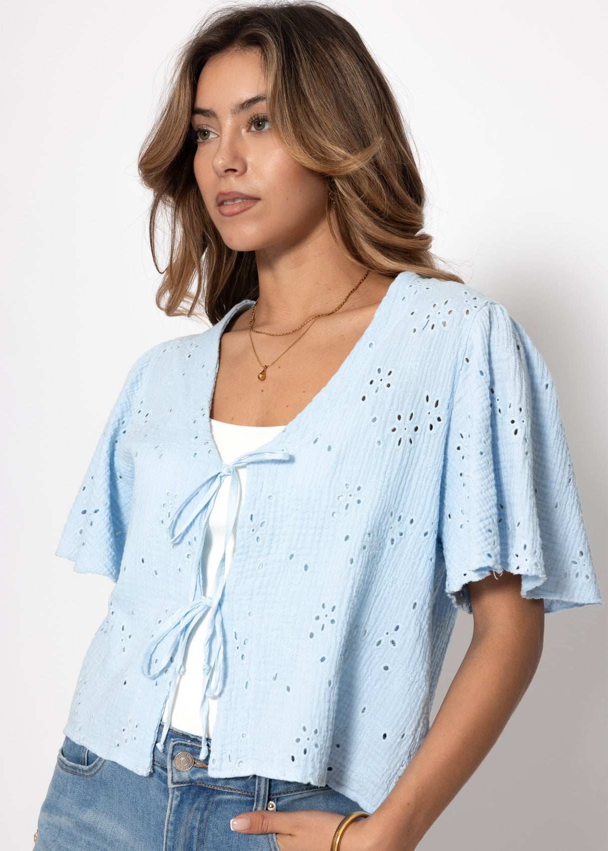 Muslin blouse with tie fastening and eyelet embroidery - light blue