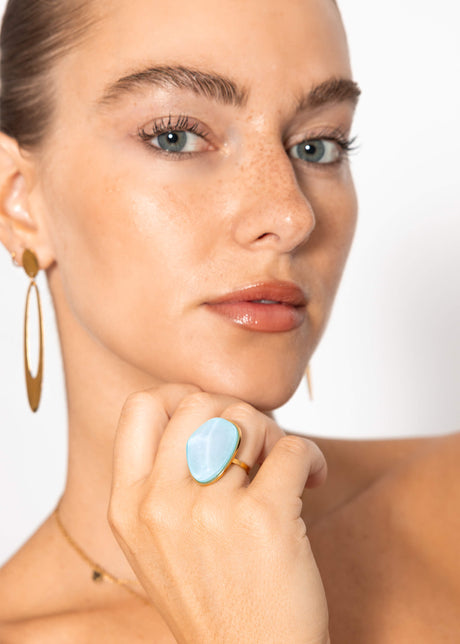 Ring with light blue gemstone - gold