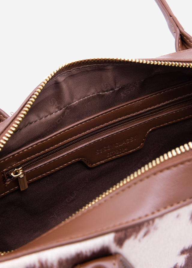 Faux leather shoulder bag with cow print - brown